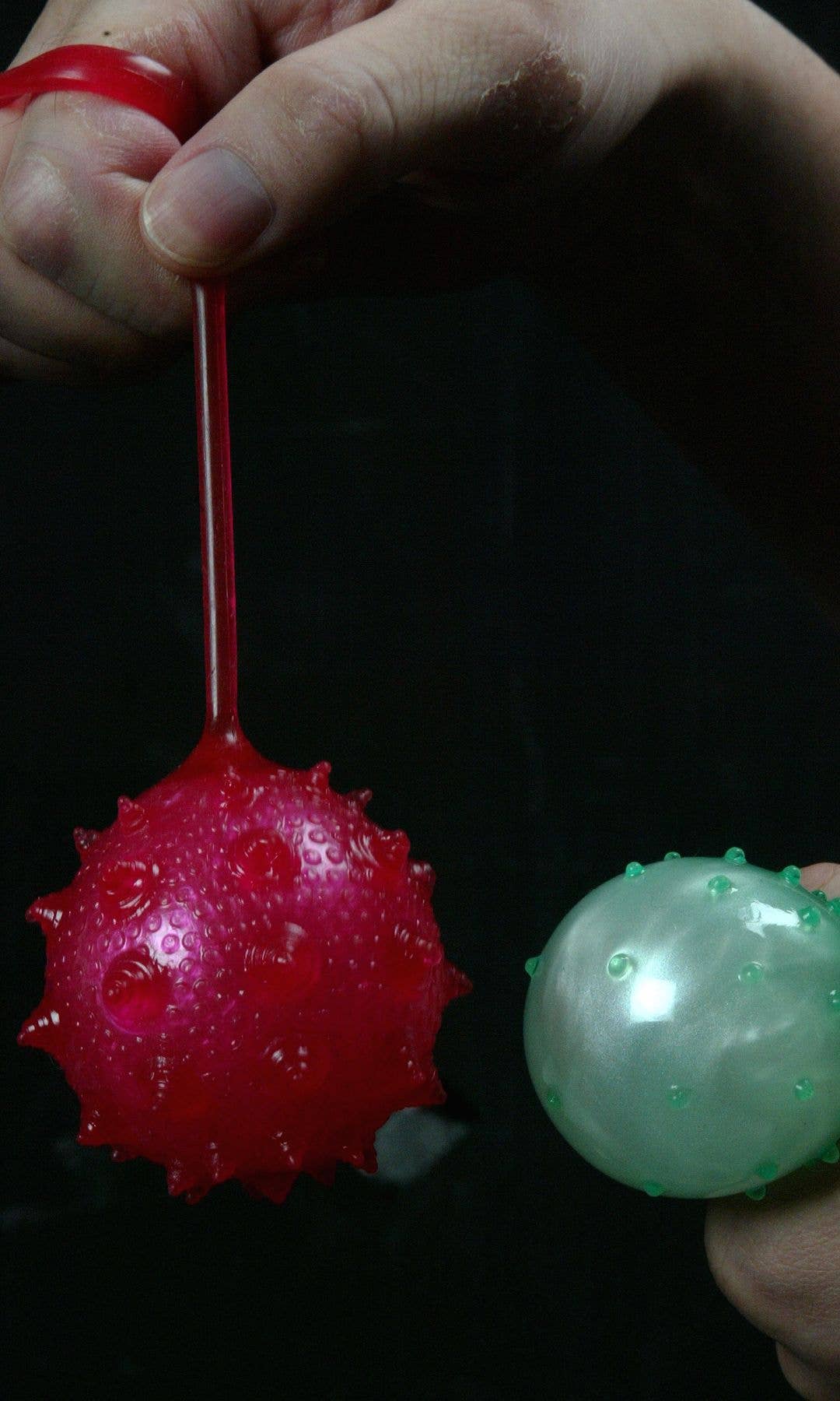 A red and green yo-yo water ball