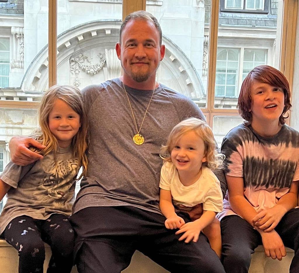 souleye sitting with his 3 kids