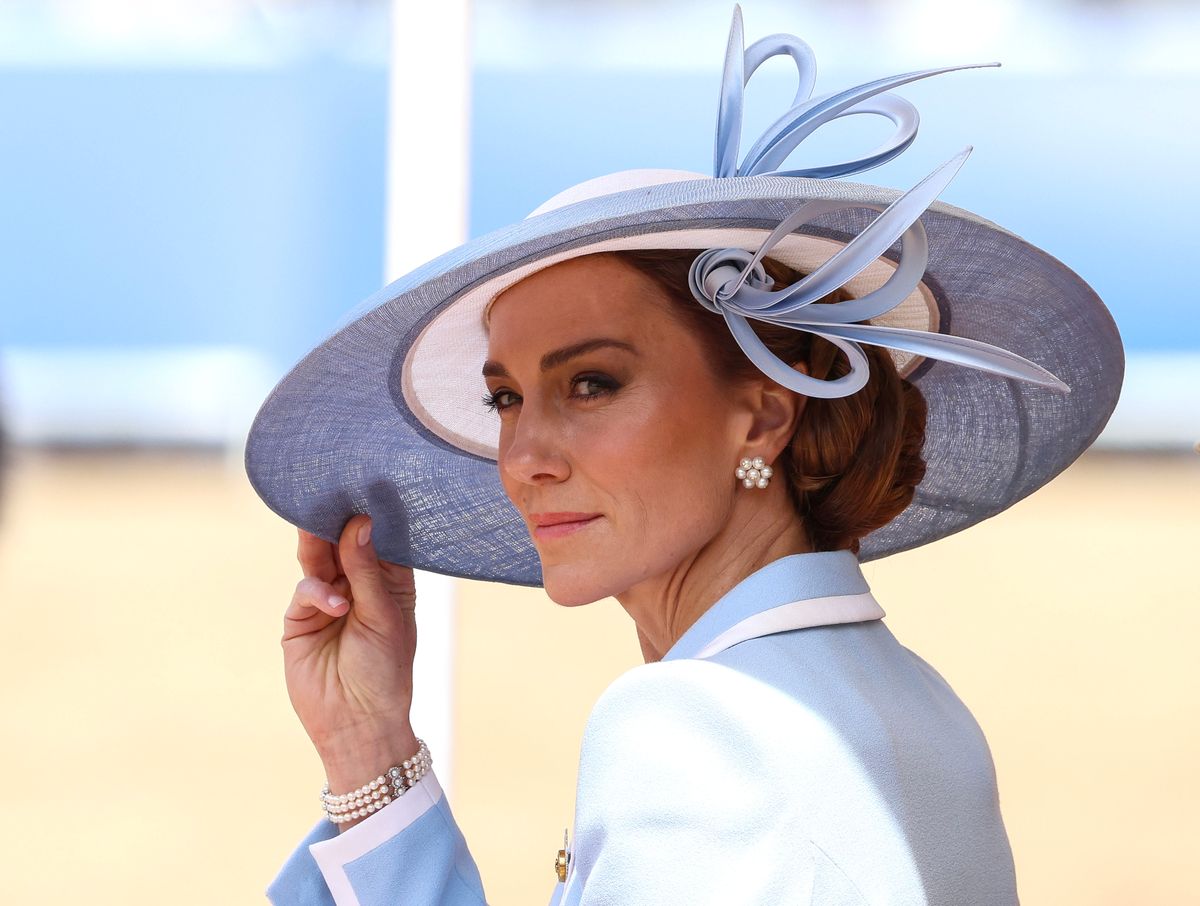 Kate's coordinated pastel-blue hat featured an oversized bow detail that elevated the monochromatic look.