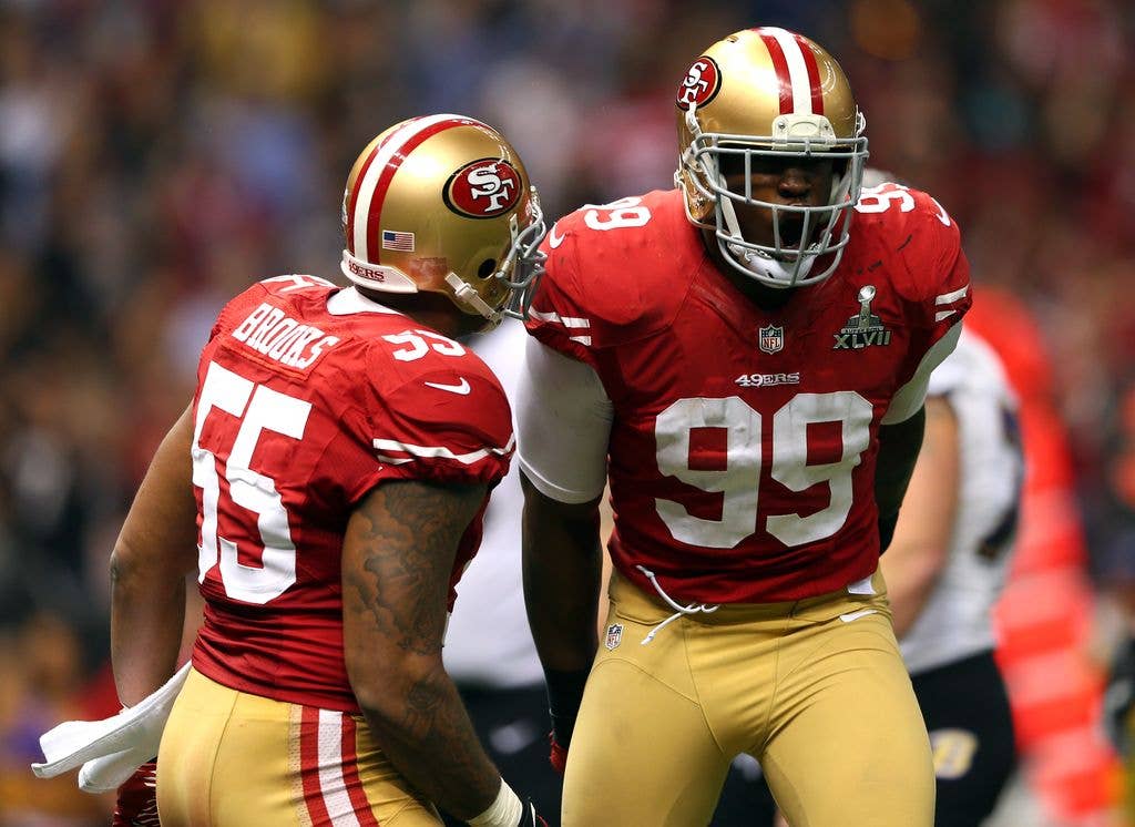 Aldon Smith #99 of the San Francisco 49ers celebrates a sack with teammate Ahmad Brooks #55 against the Baltimore Ravens during Super Bowl XLVII at the Mercedes-Benz Superdome on February 3, 2013 in New Orleans, Louisiana