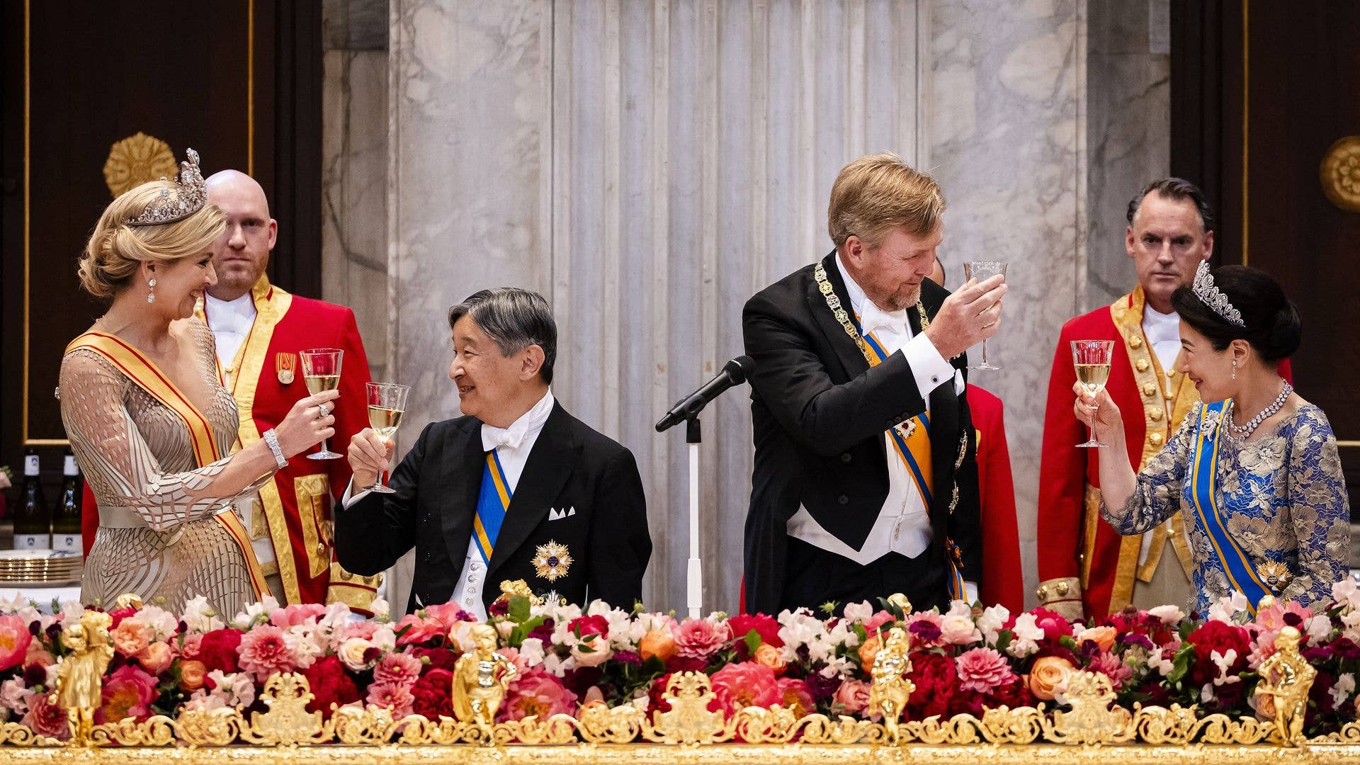 Queen Máxima, Willem-Alexander, Crown Prince Naruhito, and Masako Owada toast with wine at a formal event.