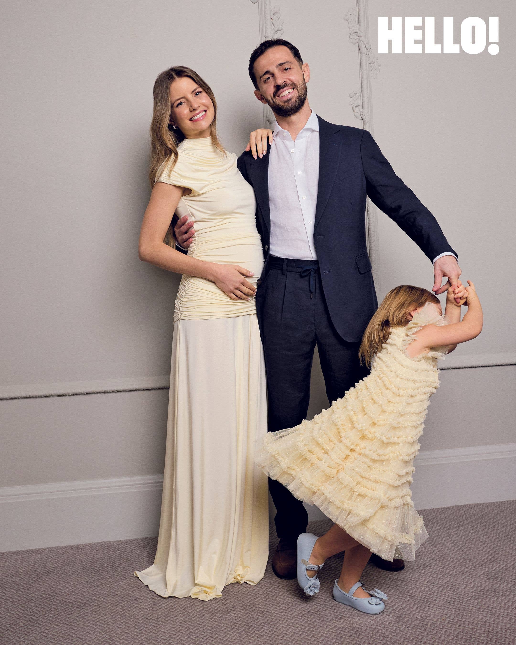 Carlota holds her father's finger as she plays during our photoshoot