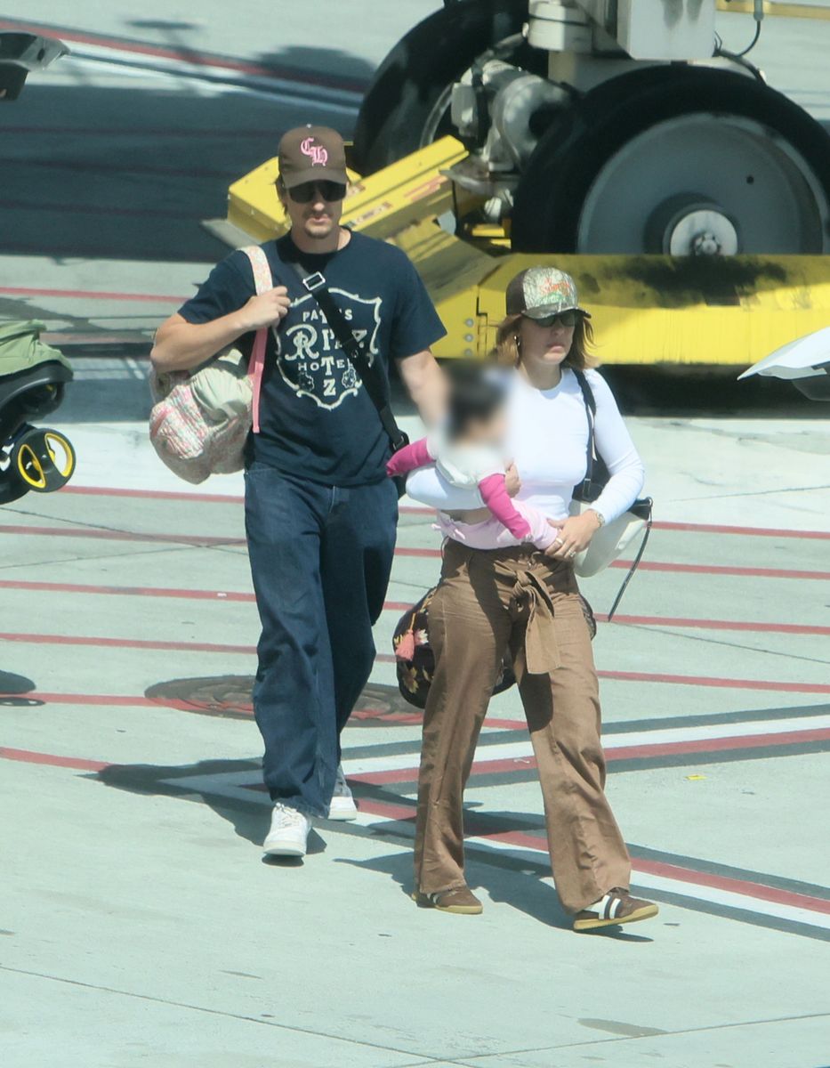 Millie Bobby Brown and Jake Bongiovi are seen with their daughter as they arrive in Los Angeles.