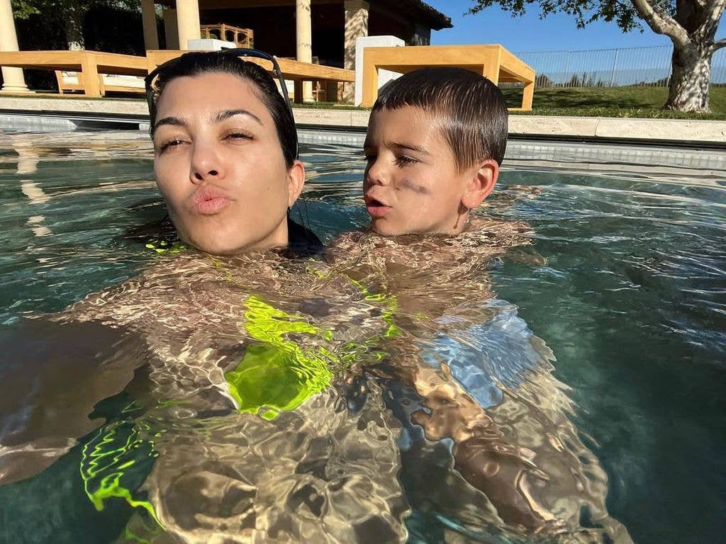 Kourtney Kardashian and her son Reign take selfies while playing in the pool