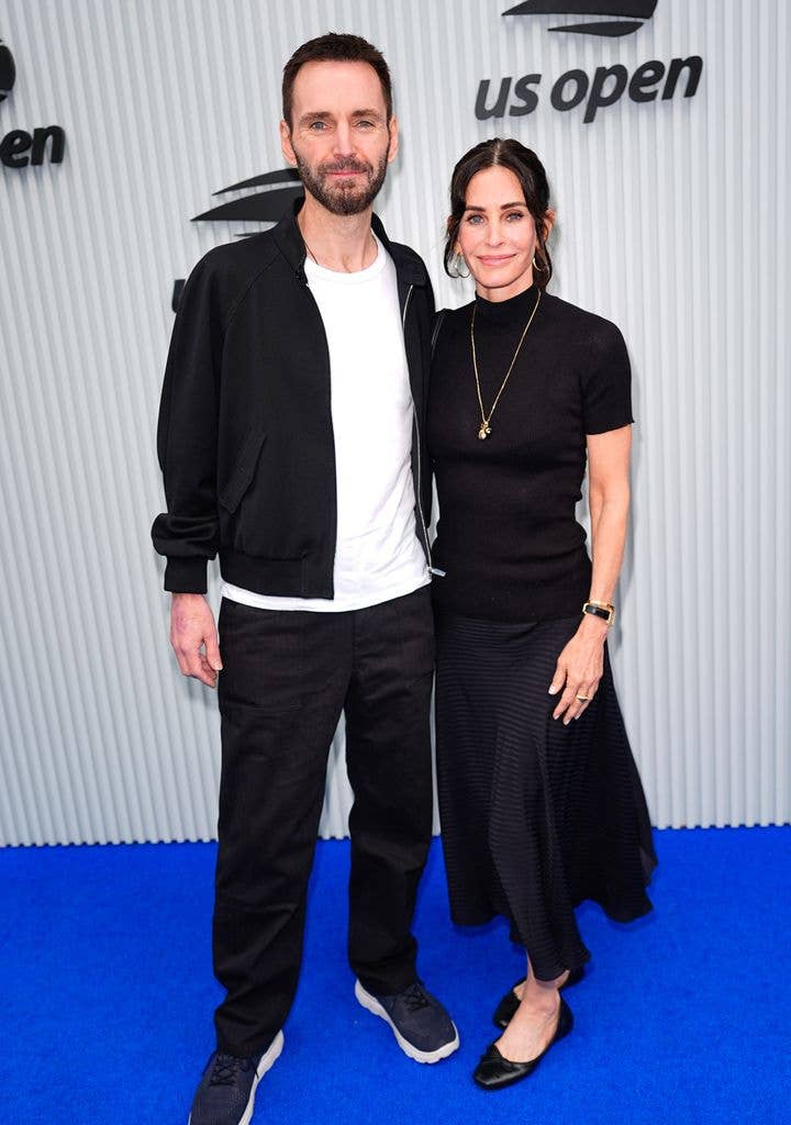 Courteney Cox and Johnny McDaid attend Day 15 of the 2025 US Open Tennis Championships at USTA Billie Jean King National Tennis Center on September 07, 2025 in Flushing Meadows, Queens, New York City.