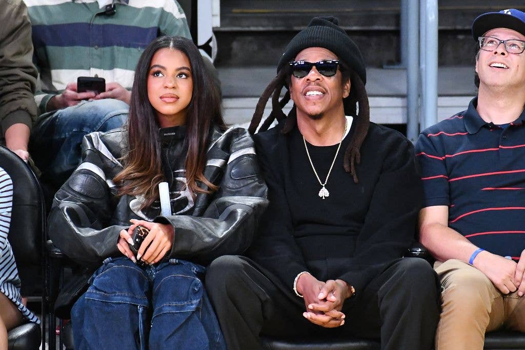 Jay-Z and Blue Ivy Carter at a basketball game between the Los Angeles Lakers and San Antonio Spurs at Crypto.com Arena o