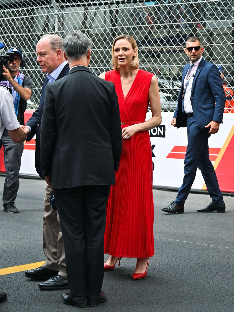 Princess Charlene arrived at the Monaco Grand Prix in a striking scarlet Solace London dress paired with matching heels.