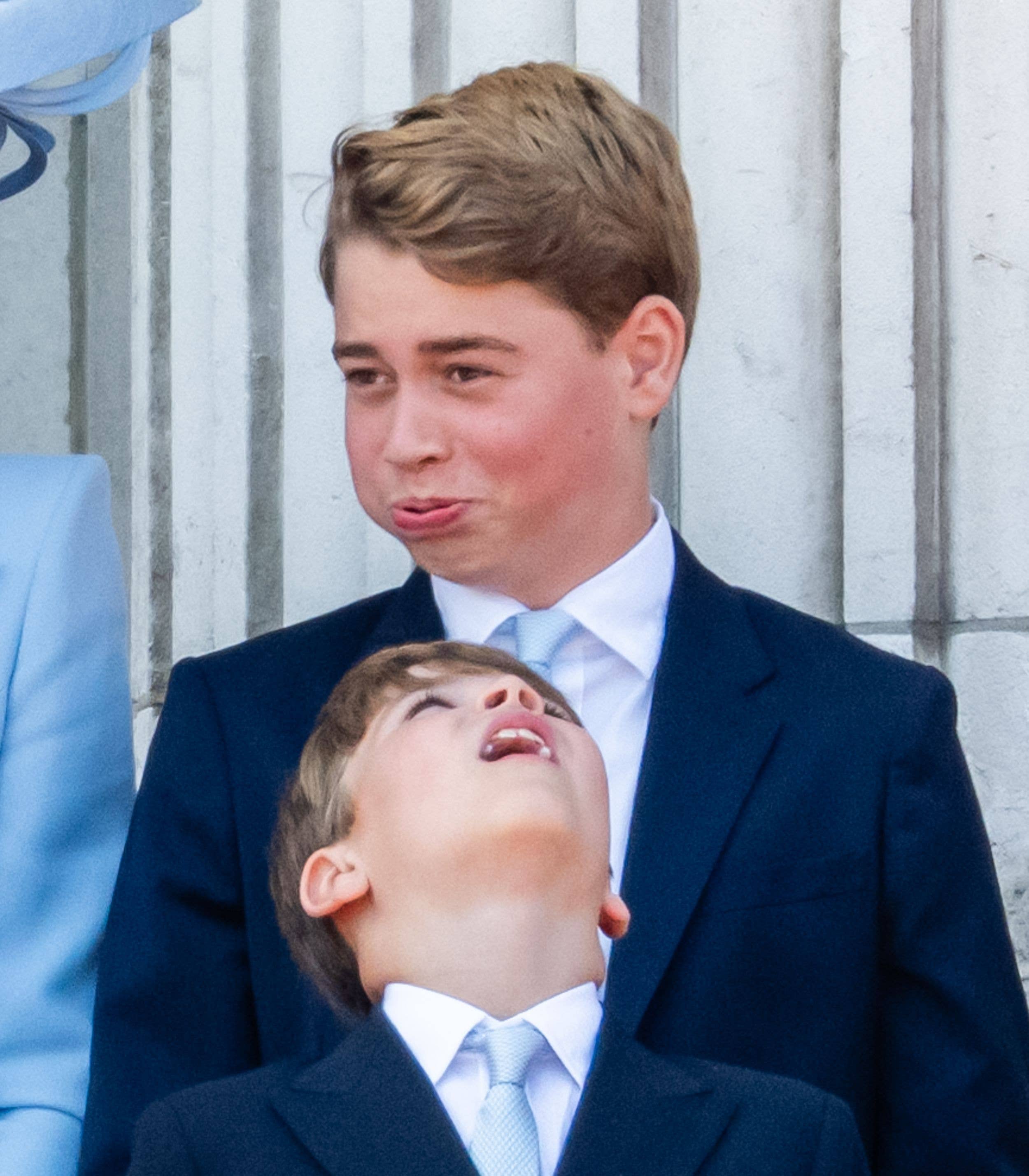 Prince Louis looks up to his brother - literally
