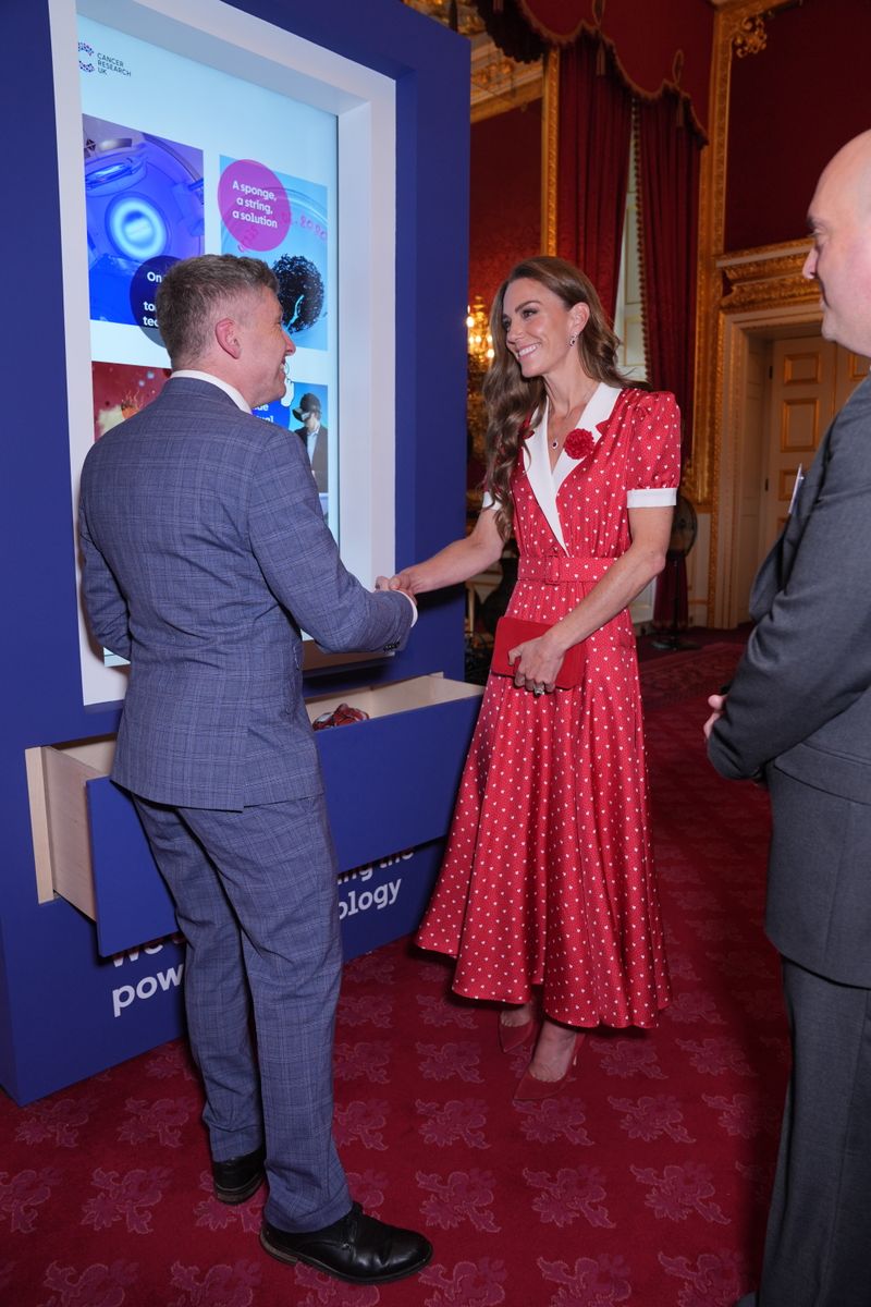 The ruby jewels symbolized courage, protection, and perseverance during the meaningful Cancer Research UK engagement.