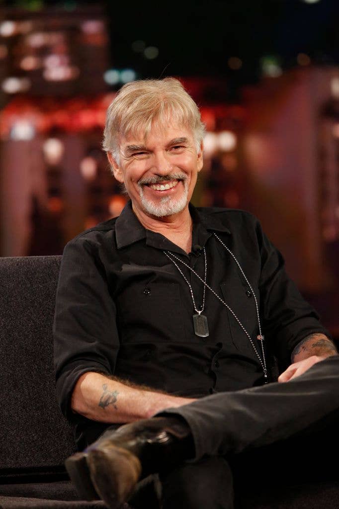 Billy Bob Thornton at Jimmy Kimmel Live in 2019 in a black shirt and trousers.