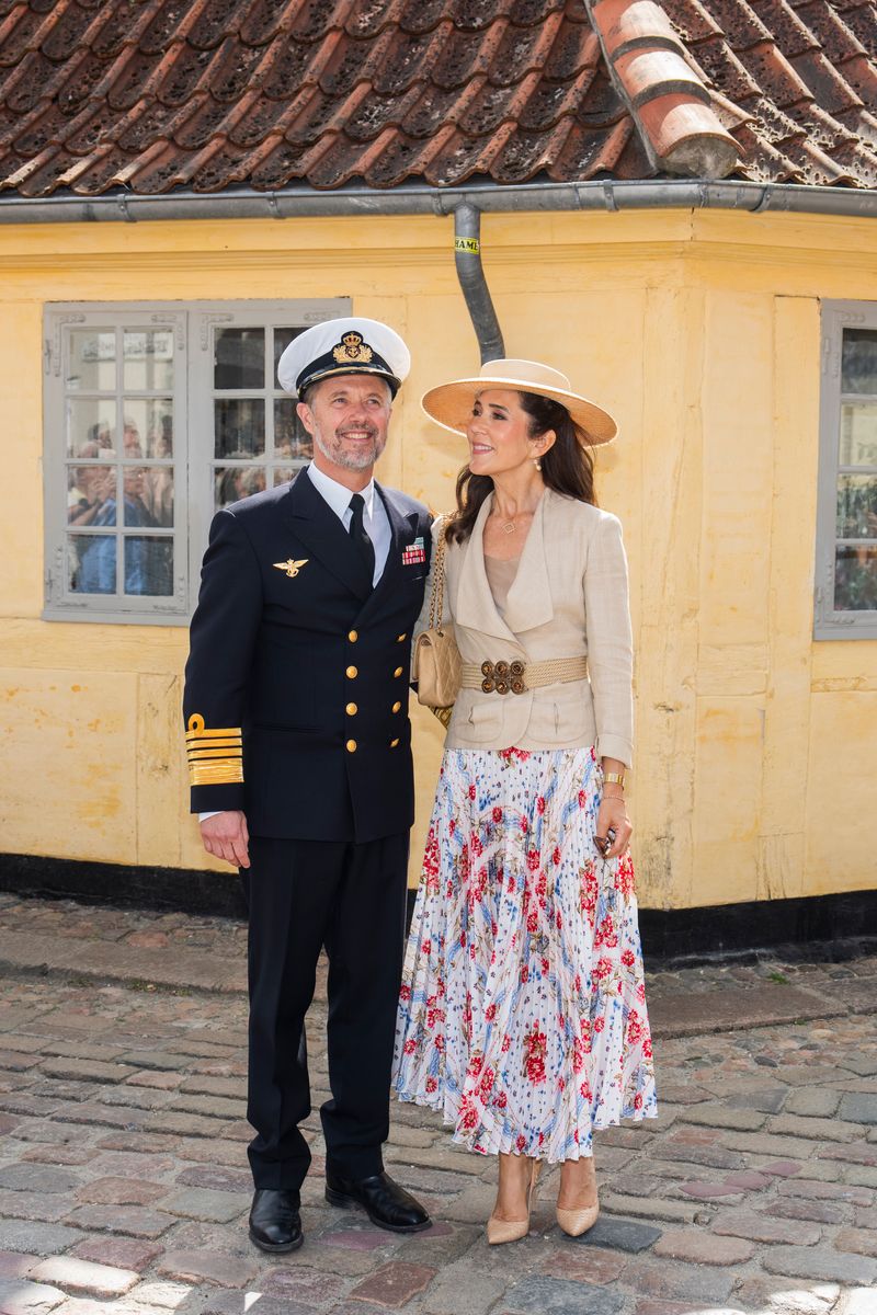 Queen Mary kept her accessories refined, allowing her romantic floral ensemble to take center stage.