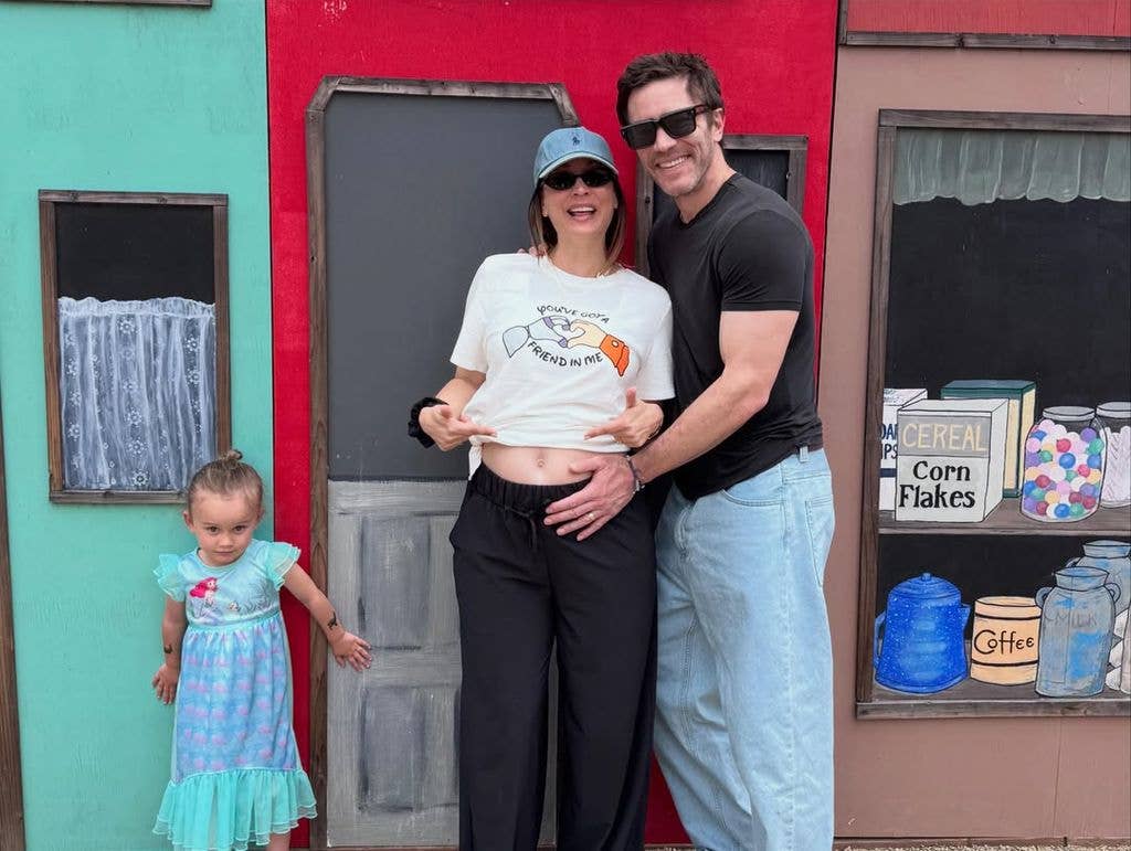Kaley Cuoco and Tom Pelphrey pose for a photo with her baby bump alongside their daughter Matilda, shared on Instagram