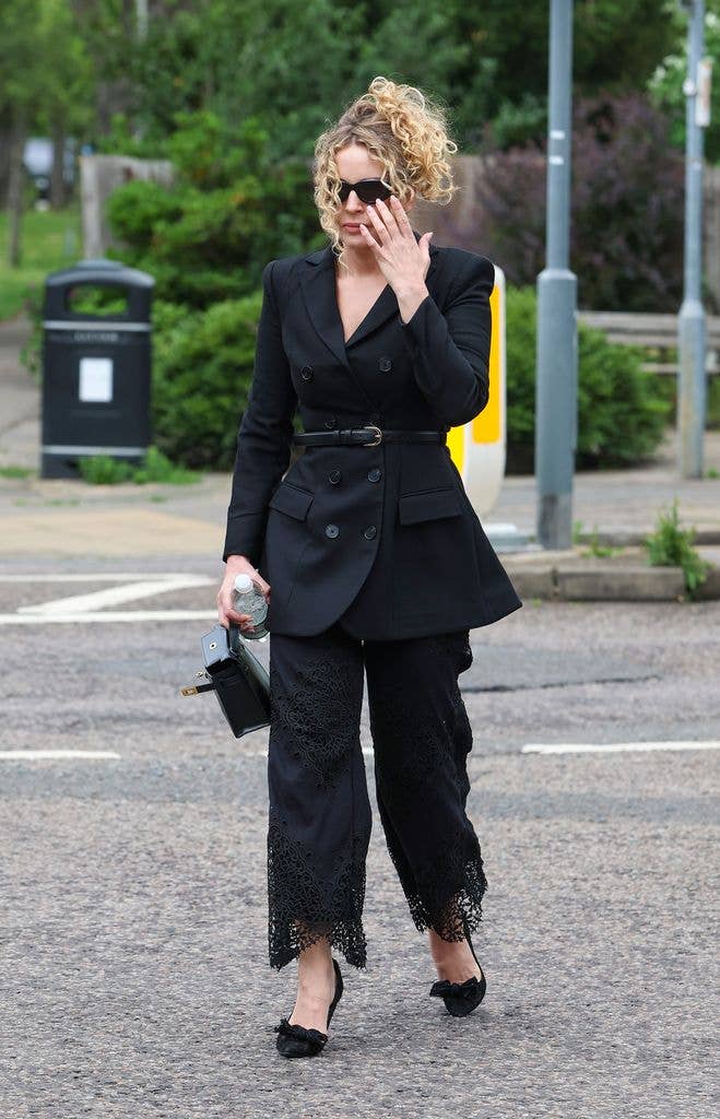 Lydia Bright wearing a black suit
