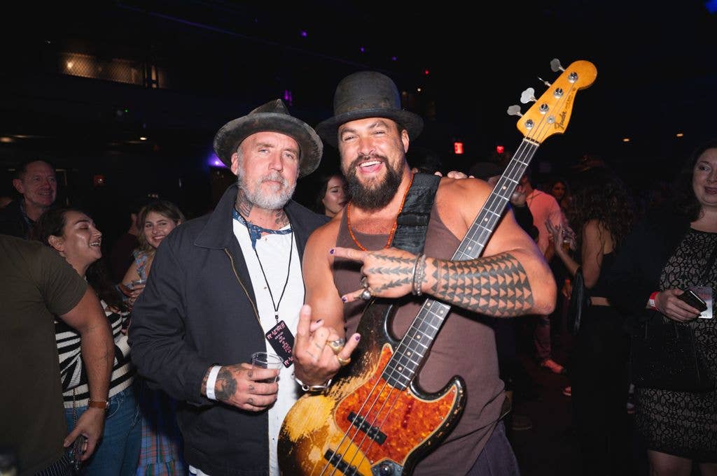 Blaine Halvorson and Jason pose during an Oof Tatata concert