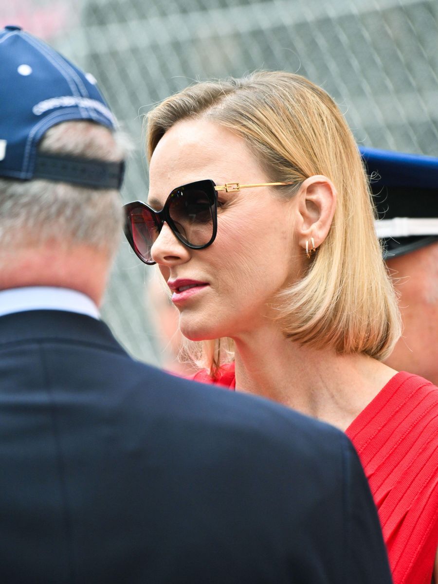 Princess Charlene completed the sophisticated look with oversized black cat-eye sunglasses.