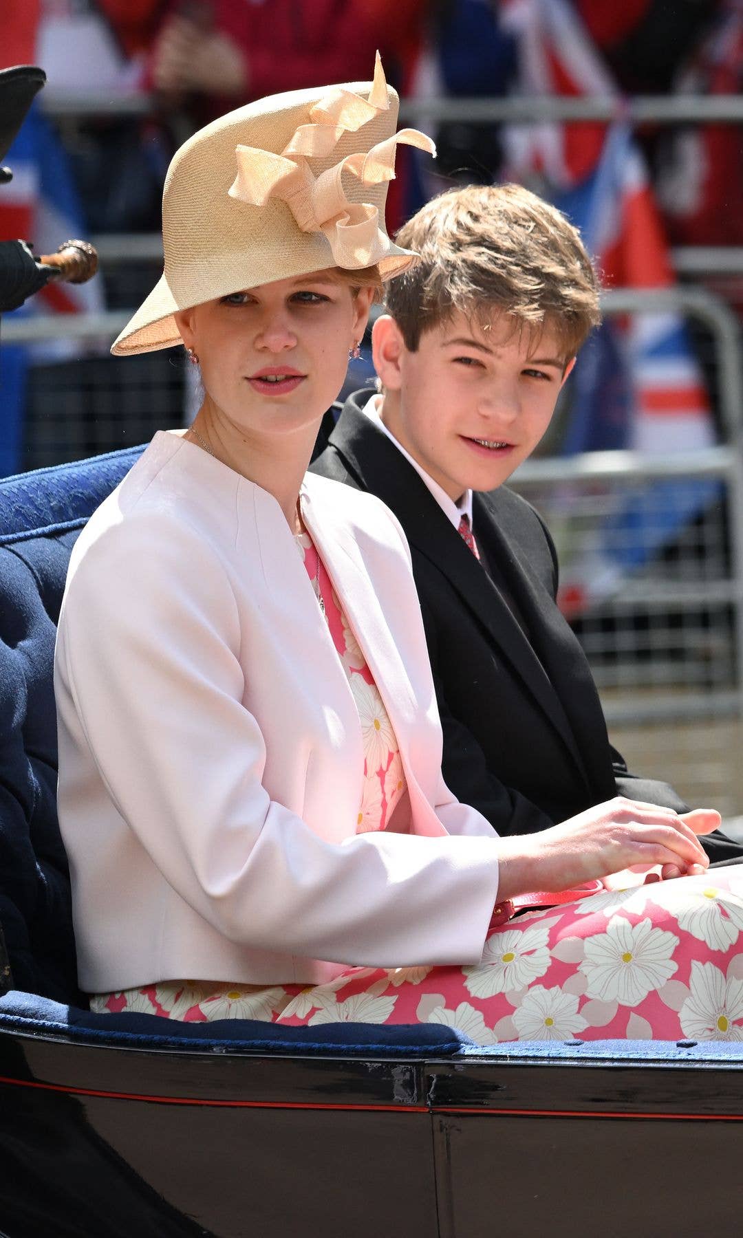 Lady Louise Windsor and James, Earl of Wessex riding in a carriage