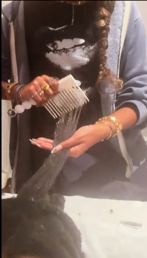 Blue Ivy appeared in The Blueprint, helping to comb out Jay-Z's hair