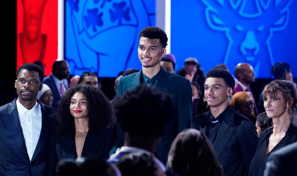 Victor Wembanyama (C) poses with his father Felix (L), sister Eve (2nd L), brother Oscar (2nd R) and mother Elodie de Fautereau (R) before being picked by the San Antonio Spurs during the NBA Draft at Barclays Center in New York city, on June 22, 2023