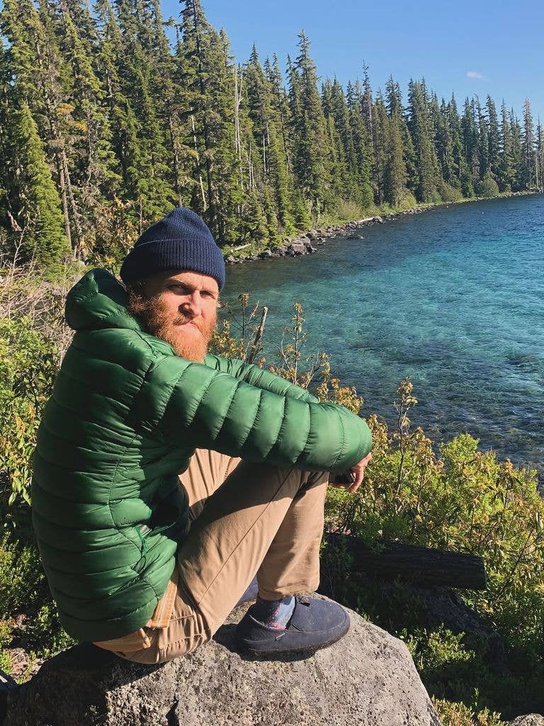 Wyatt Russell posing for a photo overlooking a lake, shared via Instagram