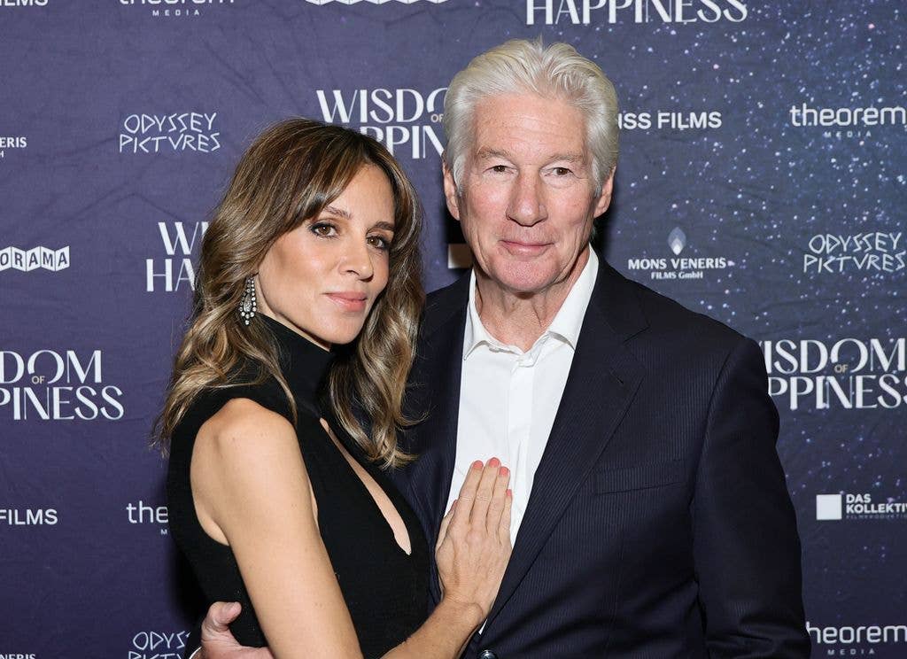 Alejandra Gere and Richard Gere hug on red carpet looking happy