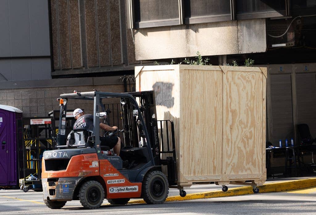 photo of worker unloading truck into madison square garden