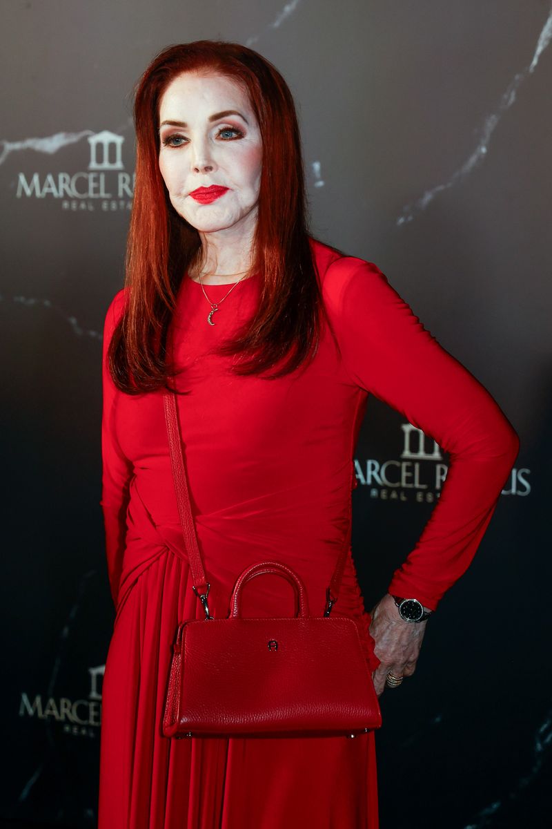 Priscilla Presley made a striking statement in a vibrant floor-length red gown during the Remus Lifestyle Night event in Mallorca.