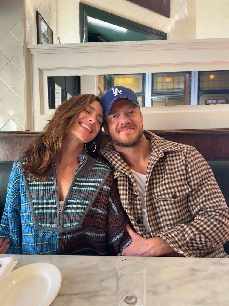 Minka Kelly and Dan Reynolds posing for a photo together, shared via Instagram