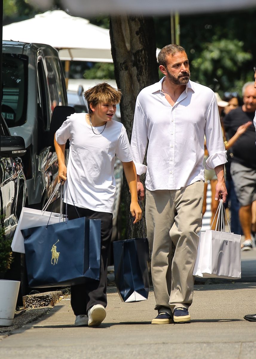 Ben Affleck and Samuel carried shopping bags as they strolled through the streets of New York following a day of shopping.