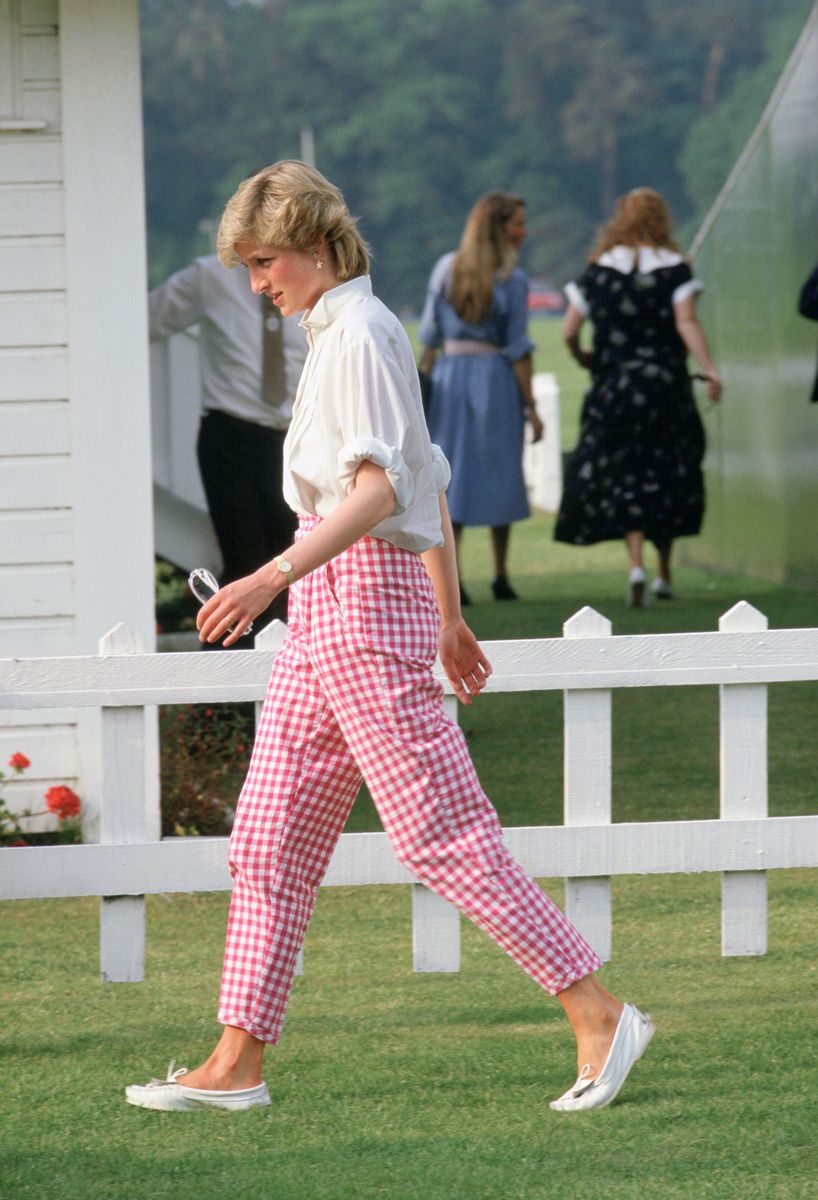 Princess Diana wore pink gingham trousers to the Guards Polo Club in Windsor, helping make the classic print a fashion favorite.