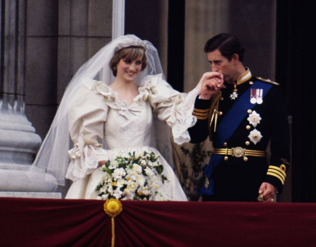 The Prince and Princess of Wales on the balcony of Buckingham Palace on their wedding day, 29th July 1981. Diana wears a wedding dress by David and Elizabeth Emmanuel and the Spencer family tiara.