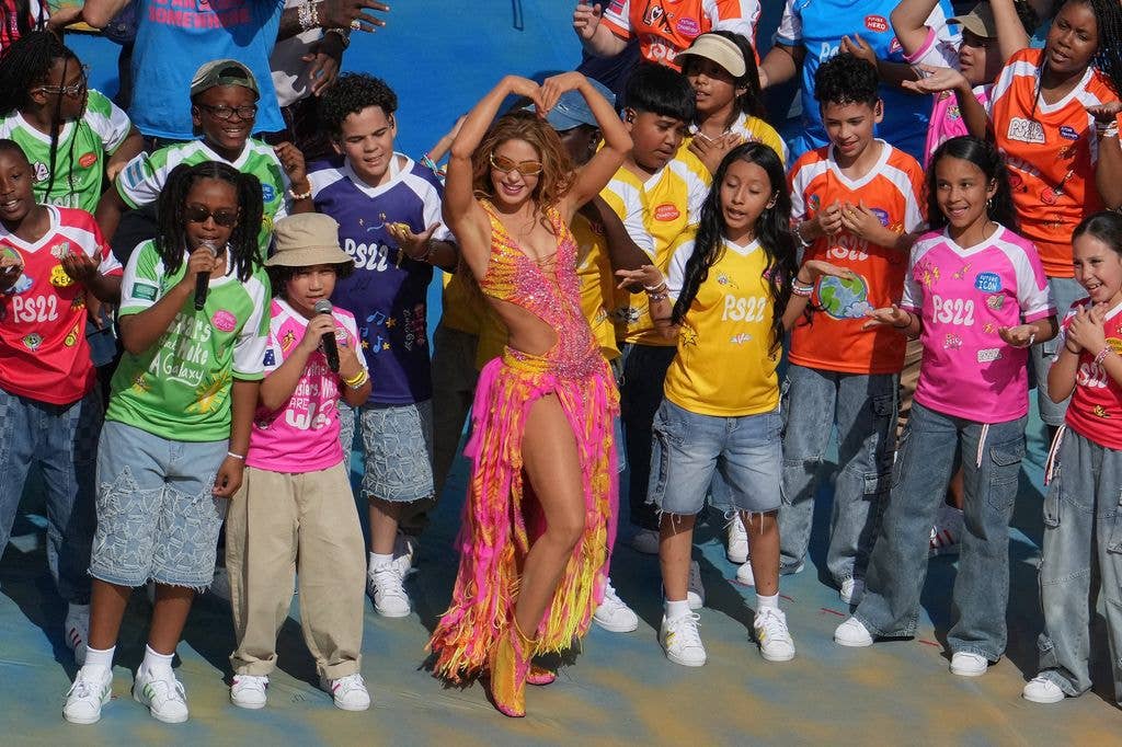 Shakira poses with children during the halftime show of the 2026 World Cup football tournament