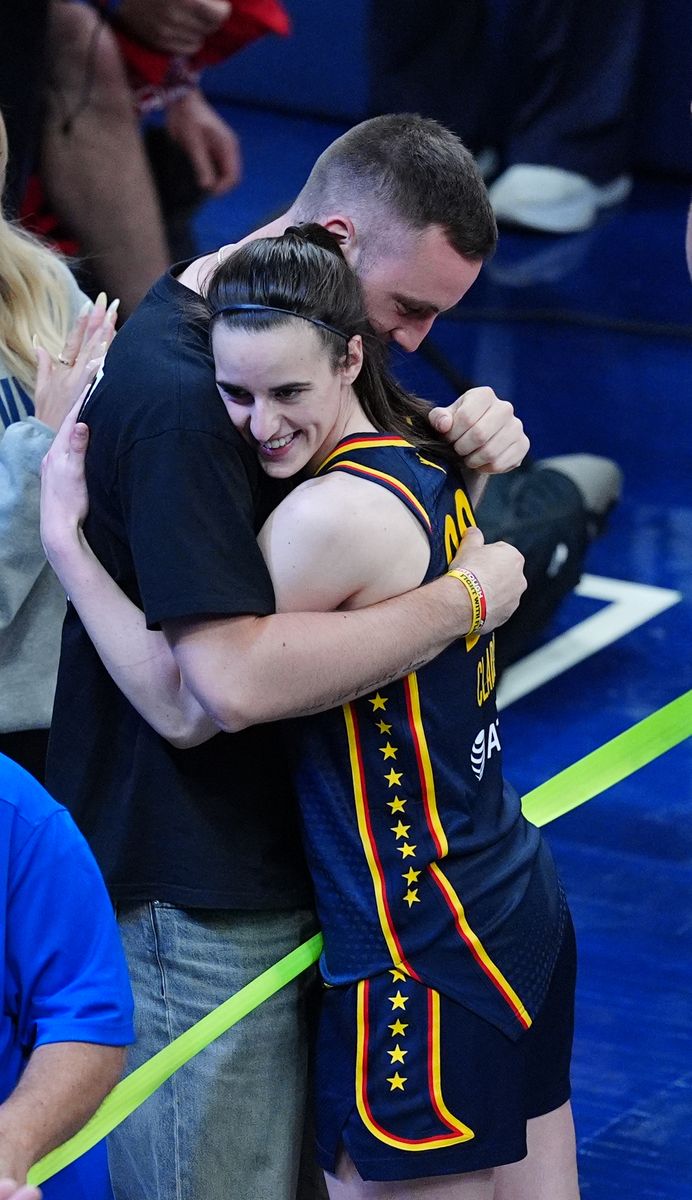 Indiana Fever guard Caitlin Clark (22) gets a hug from her boyfriend Connor McCaffery after winning a game against the New York Liberty