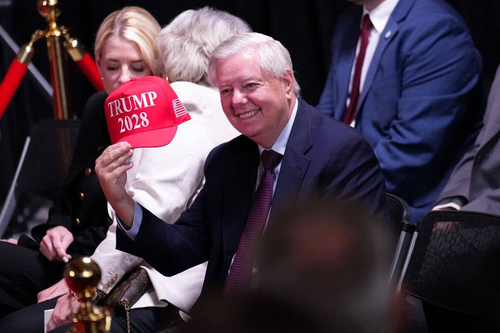 Sen. Lindsey Graham (R-SC) holds up a hat that reads "Trump 2028" during an event at the Kennedy Center on August 13, 2025 in Washington, DC. U.S.
