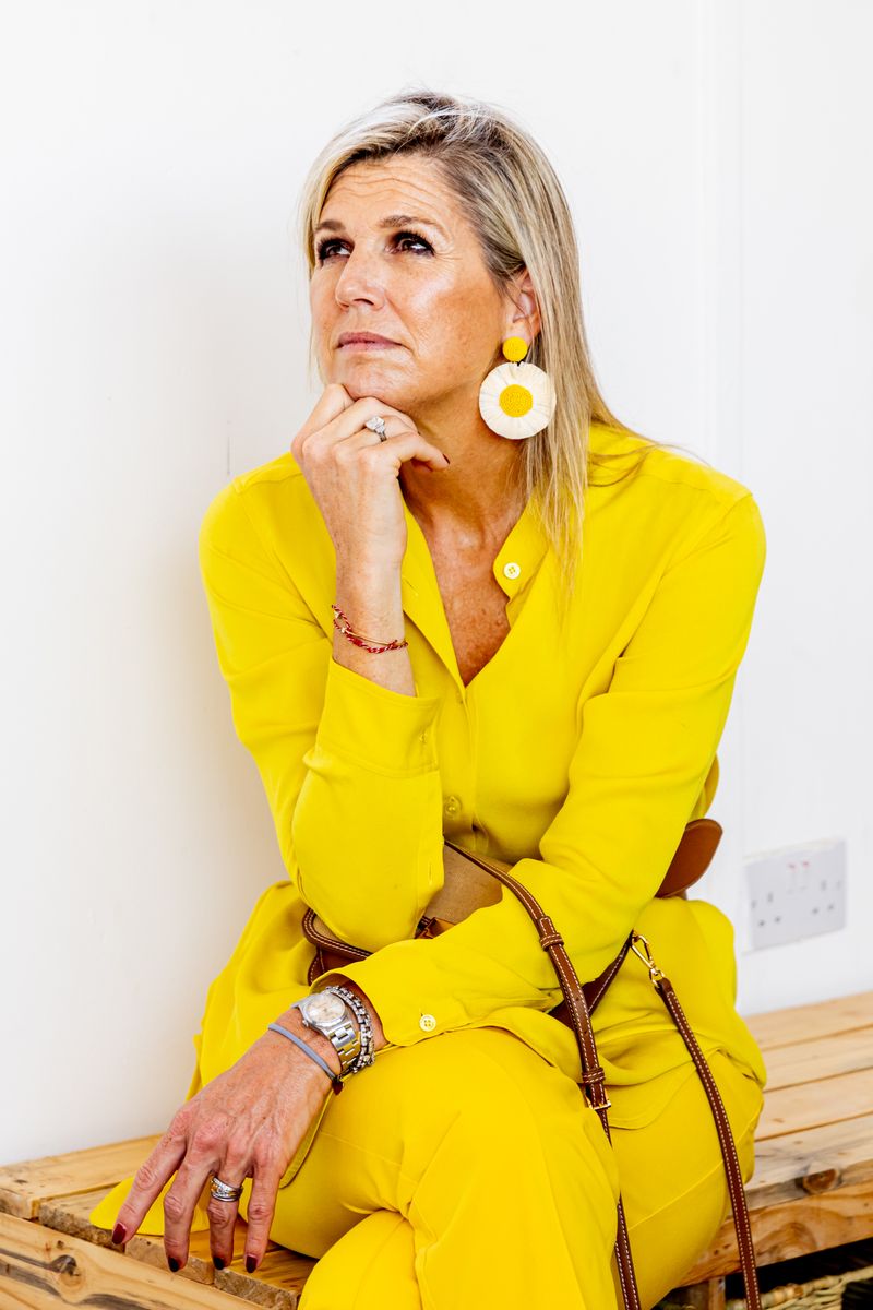 The Dutch queen often pairs eye-catching accessories with colorful looks that reflect her confident sense of style.