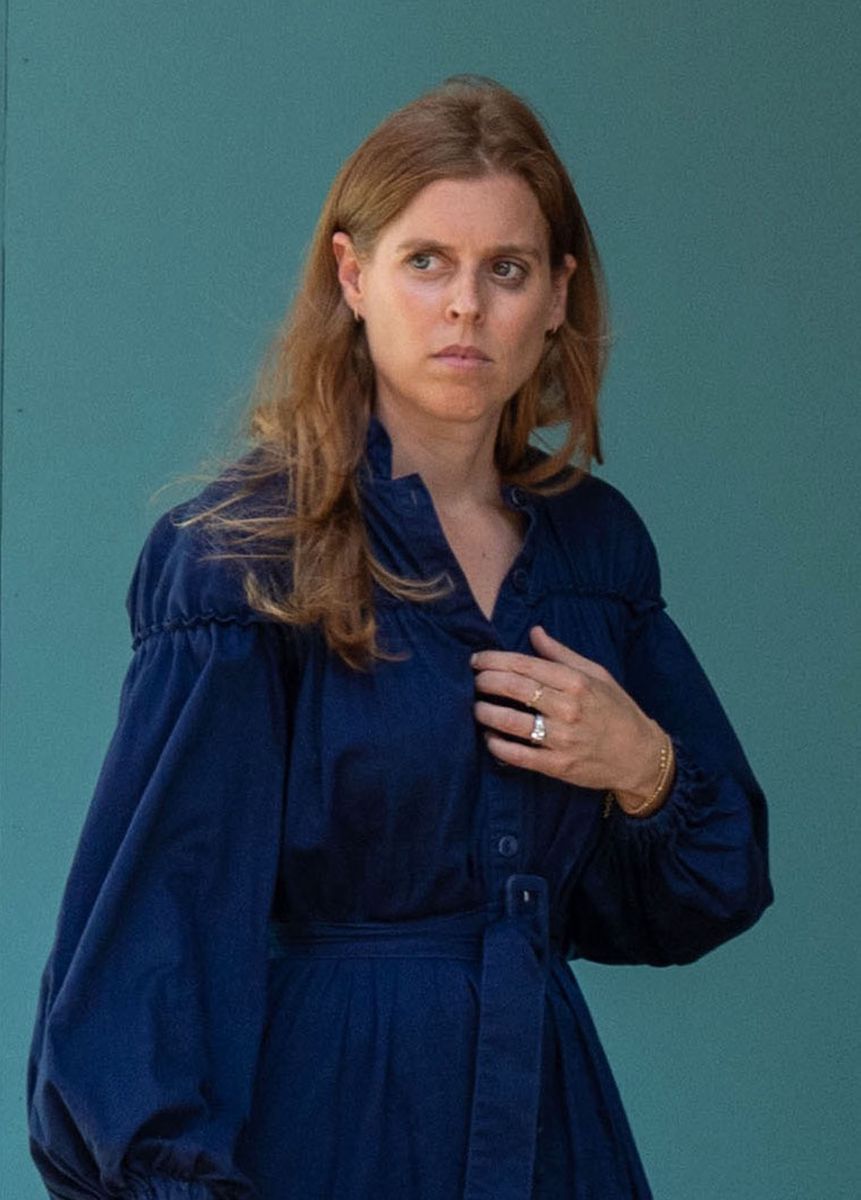 The royal embraced understated summer style with a flowing navy dress, minimal accessories and a natural beauty look while visiting one of Queen Elizabeth II's favorite London stores.