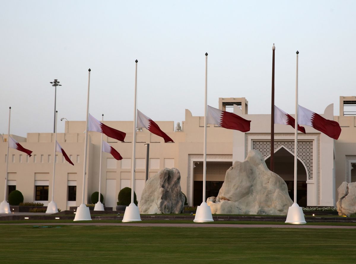 Qatari national flags are flown at half-mast above a government building after the death of Emir Sheikh Hamad bin Khalifa Al Thani in Doha, Qatar, on July 12, 2026.