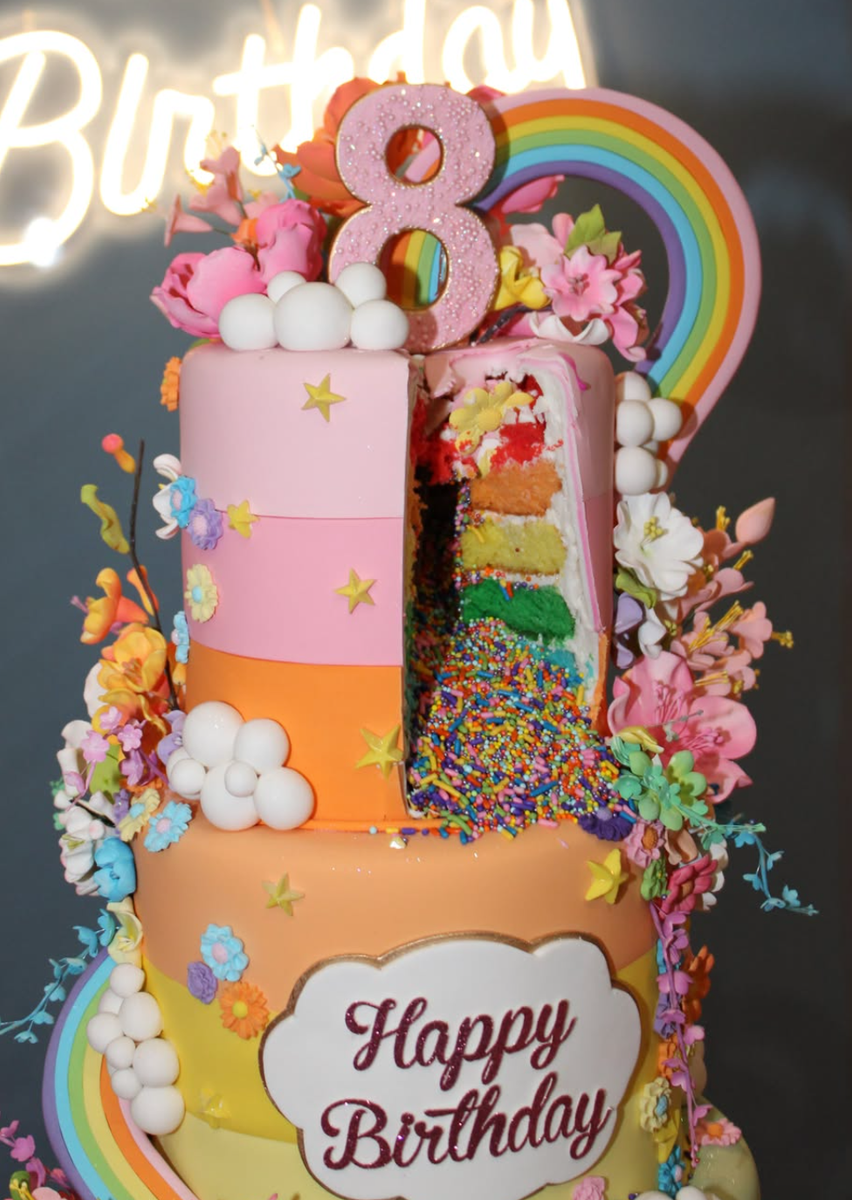 The towering four-tier creation stood approximately 3.5 feet tall and featured more than 700 handcrafted sugar flowers,