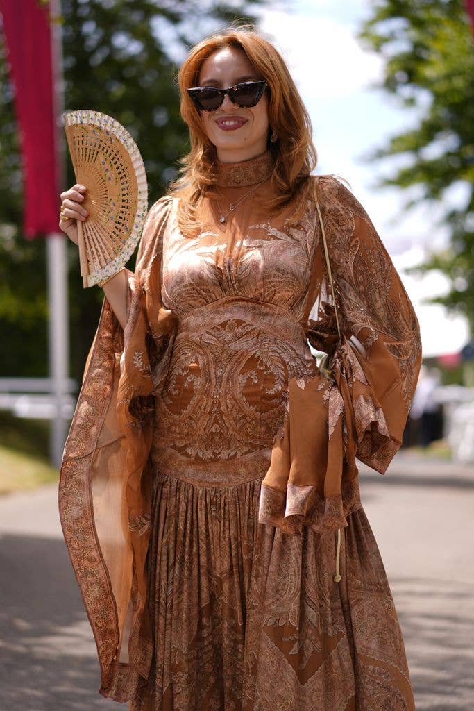 A racegoer arrives for day one of the Qatar Goodwood Festival at Goodwood Racecourse, Chichester. Picture date: Tuesday July 28, 2026. (Photo by Andrew Matthews/PA Images via Getty Images)