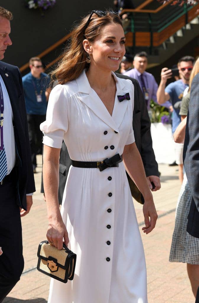 The Princess teamed the classic style with a chic raffia bag