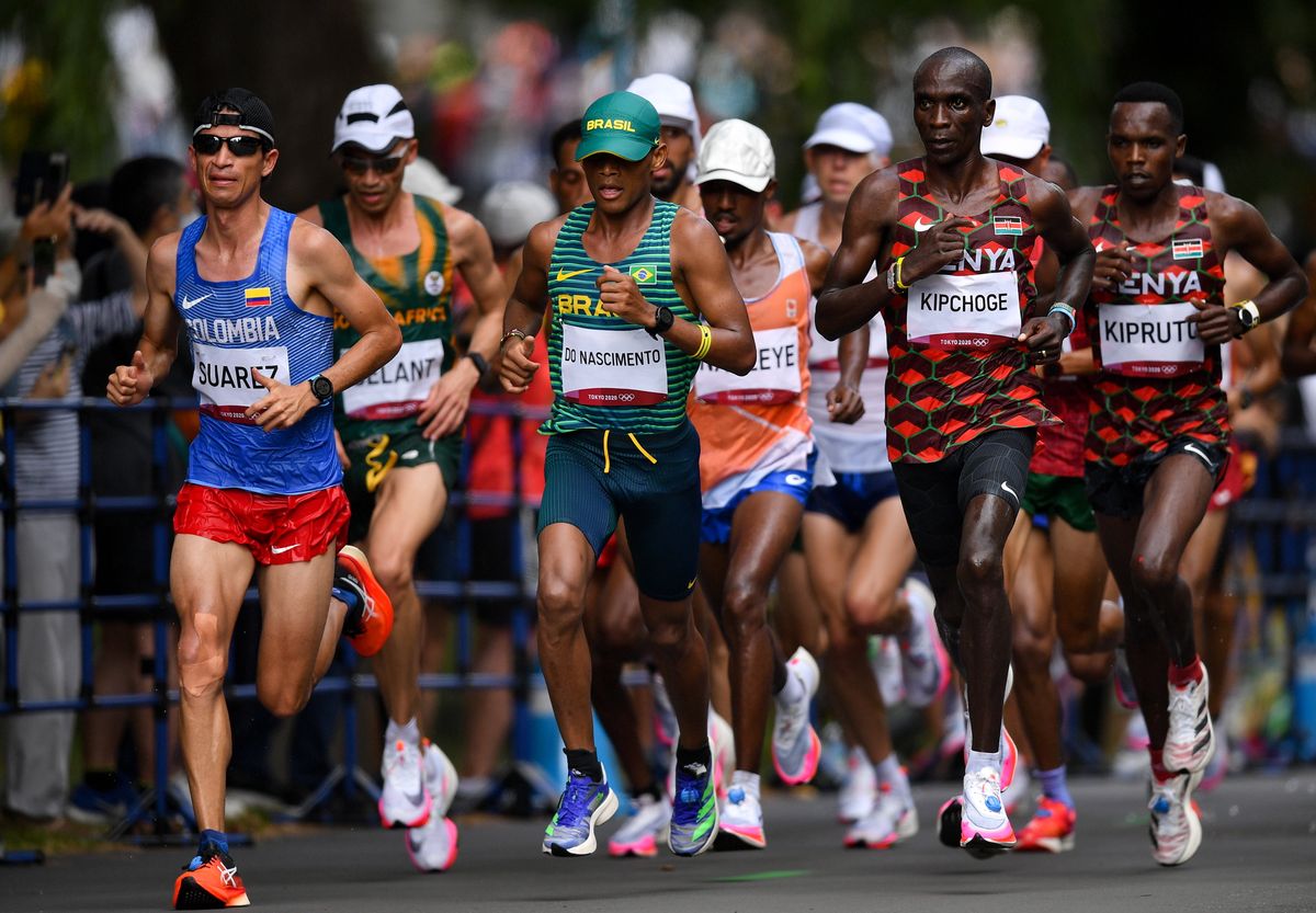 Runners, from left, Jeison Alexander Suarez of Colombia, Daniel Do Nascimento of Brazil, Eliud Kipchoge of Kenya and Amos Kipruto of Kenya during the men's marathon at Sapporo Odori Park