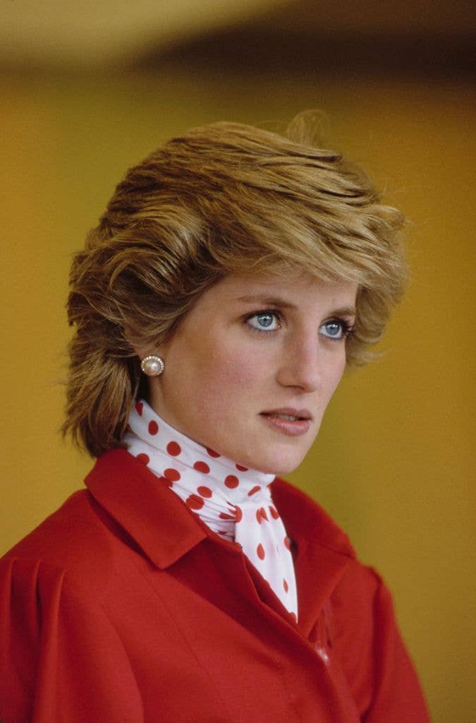 Princess Diana in a red jacket with a bob
