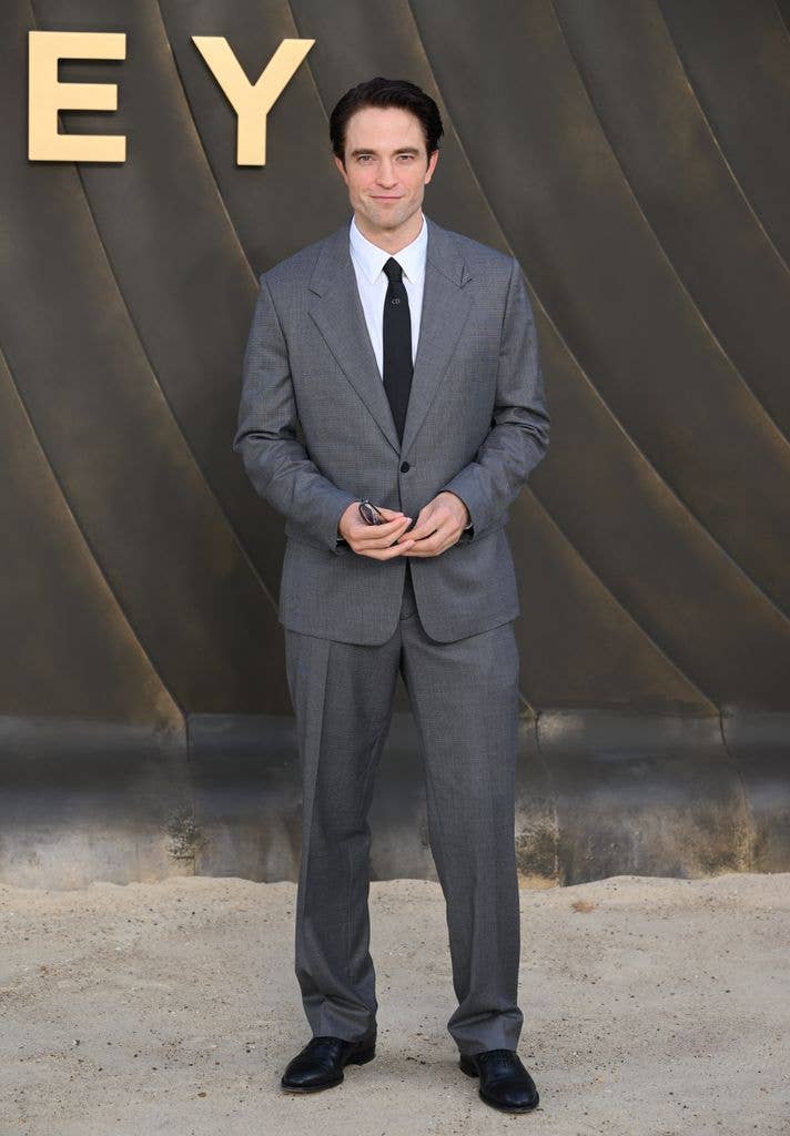 robert pattinson gray suit the odyssey