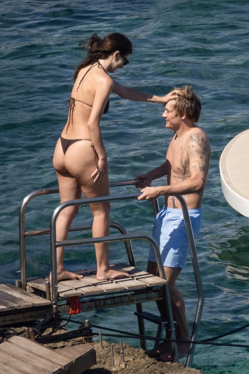 Camila Morrone and Cole Bennett shared affectionate moments before cooling off with a swim in the crystal-clear waters.