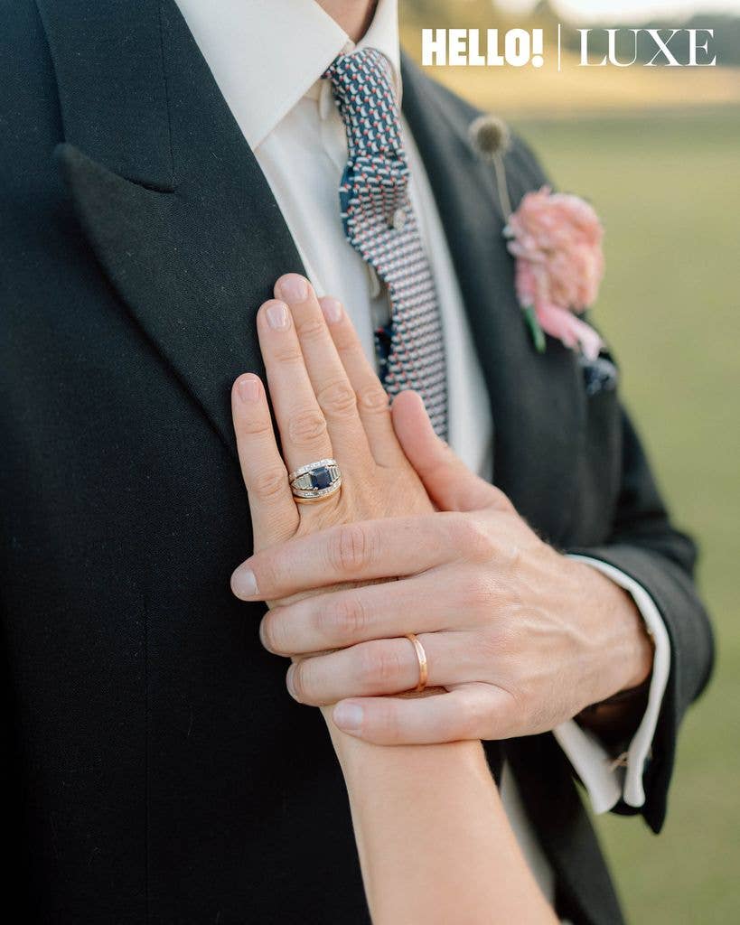A closer look at the couple's wedding rings, highlighting Lady Marina's modified heirloom engagement ring -originally belonging to Nico’s grandmother - which features a platinum sapphire and baguette diamonds.