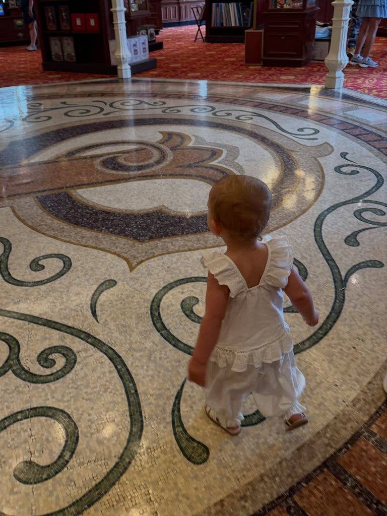 Michelle Keegan's daughter in a white ruffled outfit