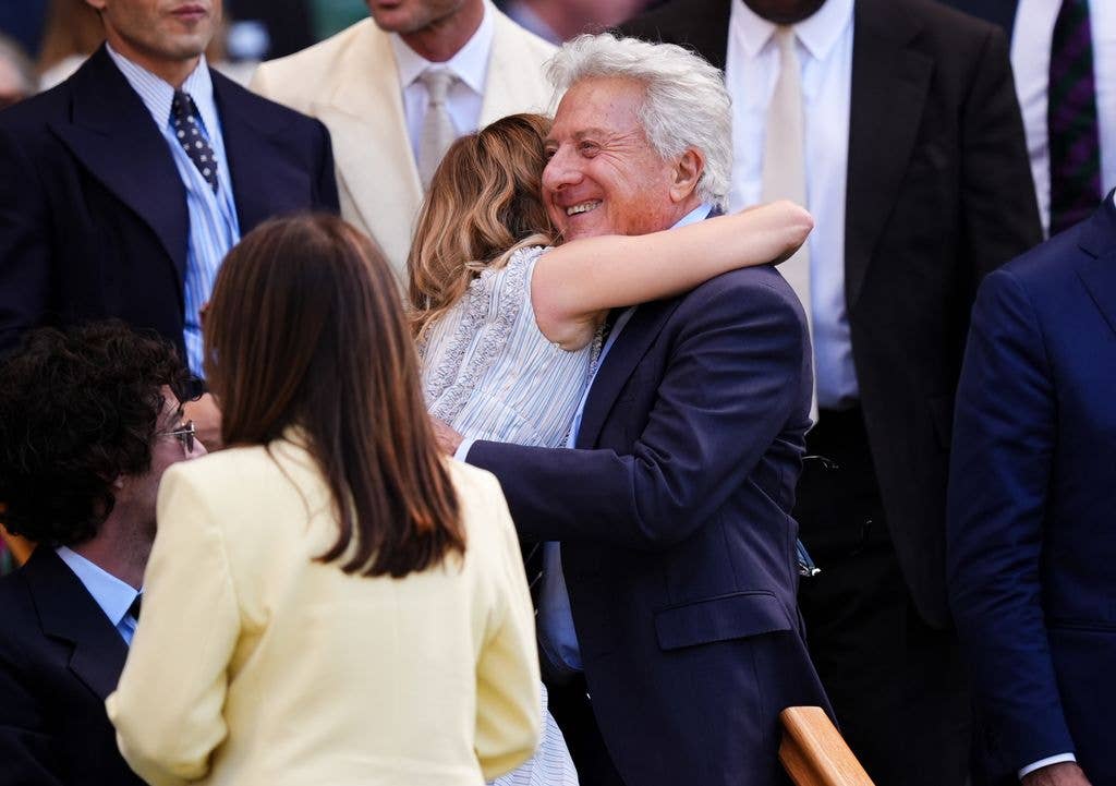 Sienna Miller hugs Dustin Hoffman in the Royal Box at Wimbledon