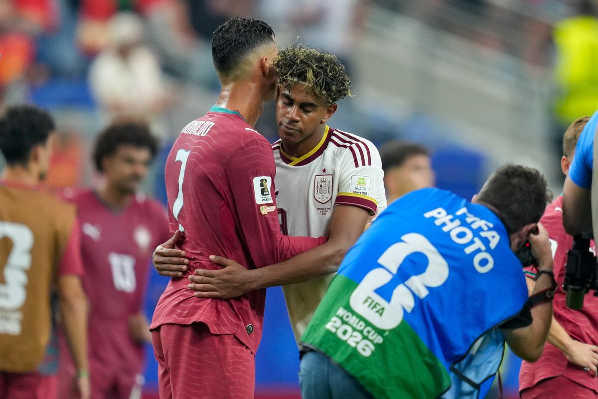 Cristiano Ronaldo of Portugal and Lamine Yamal of Spain hugh each other during the FIFA World Cup 2026 Round Of 16 match