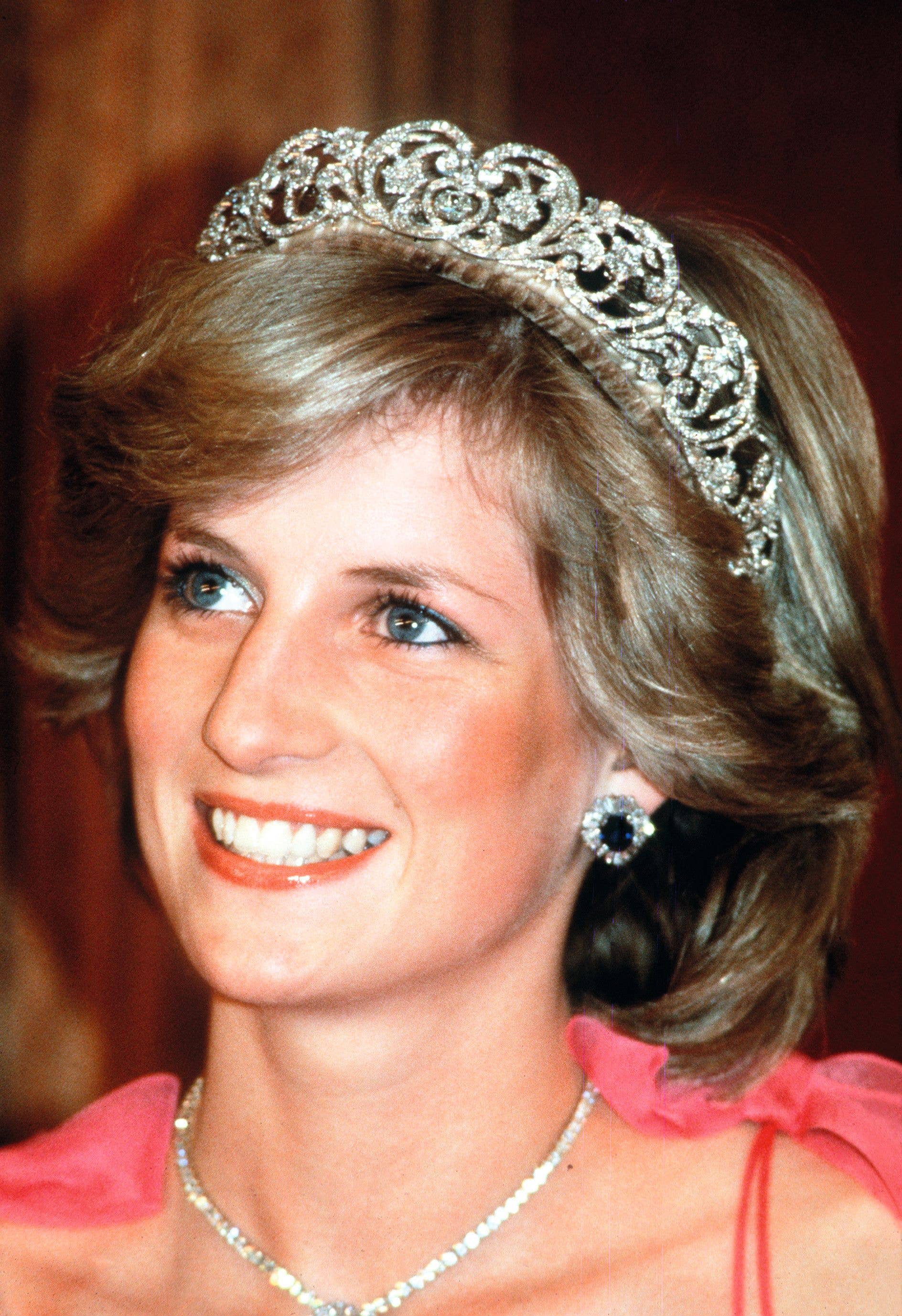Diana in the Spencer family tiara and her famous diamond and sapphire jewels on a visit to Brisbane, Australia, in 1983
