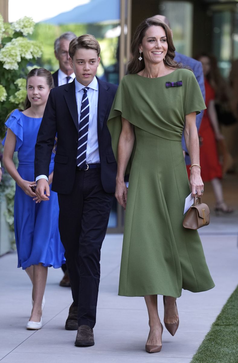 Kate Middleton walks into the All England Club alongside Prince George and Princess Charlotte before the Wimbledon men's final, with the royal trio drawing plenty of attention as they arrived together.