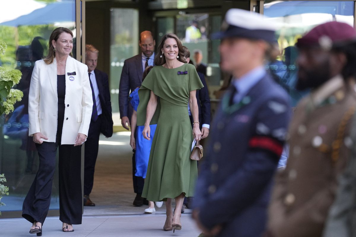 The Princess of Wales completed her polished look with the All England Club's signature green-and-purple ribbon, symbolizing her role as the tournament's royal patron.